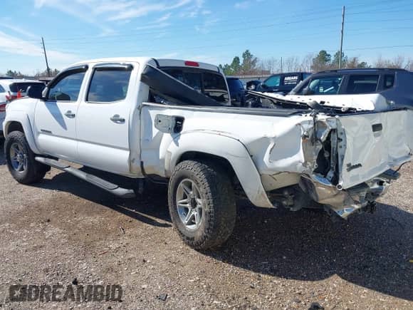 2013 Toyota Tacoma PreRunner with VIN 3TMKU4HN8DM038566, listed as a IAAI auction lot 41296386 with 153,240 mi miles and . Bid and sale history available at DreamBid. Image 3.