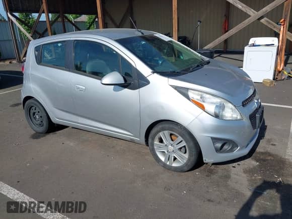 2014 Chevrolet Spark LS with VIN KL8CB6S95EC453597, listed as a IAAI auction lot 42454469 with 104,181 mi miles and . Bid and sale history available at DreamBid. Image 1.