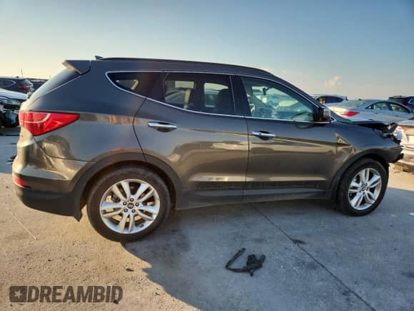 2014 Hyundai Santa Fe с VIN 5XYZW3LA3EG132618, выставлен на аукционе Copart как лот 70178815 с пробегом 119 569 миль миль и Списание • Salvage title. История ставок и продаж доступна на DreamBid. Изображение 3.