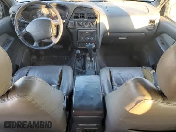 1999 Nissan Pathfinder XE with VIN JN8AR05Y4XW317915, listed as a Copart auction lot 82496174 with 301,862 mi miles and Salvage title. Bid and sale history available at DreamBid. Image 8.