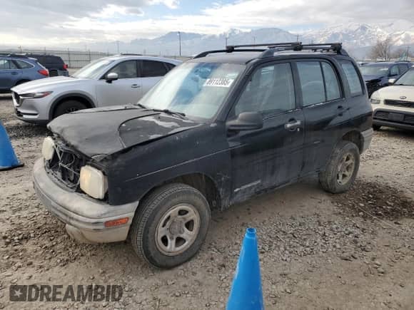 2000 Chevrolet Tracker with VIN 2CNBJ13C8Y6955130, listed as a Copart auction lot 89112385 with 289,680 mi miles and Salvage title. Bid and sale history available at DreamBid. Image 1.