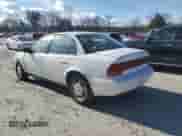 1996 Saturn SL with VIN 1G8ZK5279TZ162812, listed as a Copart auction lot 87079874 with 143,461 mi miles and Salvage title. Bid and sale history available at DreamBid. Image 2.