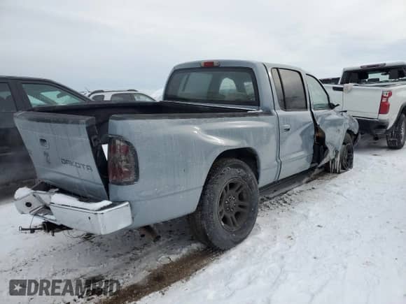 2003 Dodge Dakota Sport with VIN 1D7HL38X03S374877, listed as a Copart auction lot 45236965 with 178,389 mi miles and Salvage title. Bid and sale history available at DreamBid. Image 3.