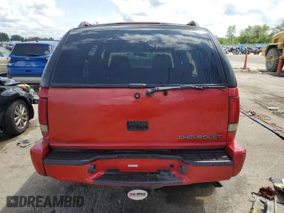 2000 Chevrolet Blazer LS z VIN 1GNDT13W7Y2341417, wystawiony jako Copart lot #65804295 z przebiegiem Nie podano mil oraz Szkoda całkowita • Salvage title. Historia ofert i sprzedaży dostępna na DreamBid. Obrazek 6.