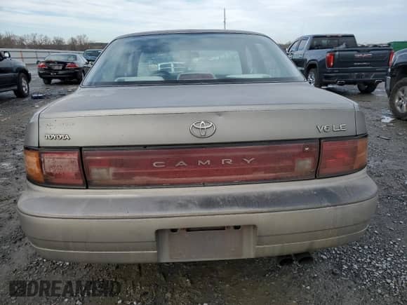 1993 Toyota Camry with VIN 4T1VK12E7PU093838, listed as a Copart auction lot 45171825 with 207,882 mi miles and Salvage title. Bid and sale history available at DreamBid. Image 6.