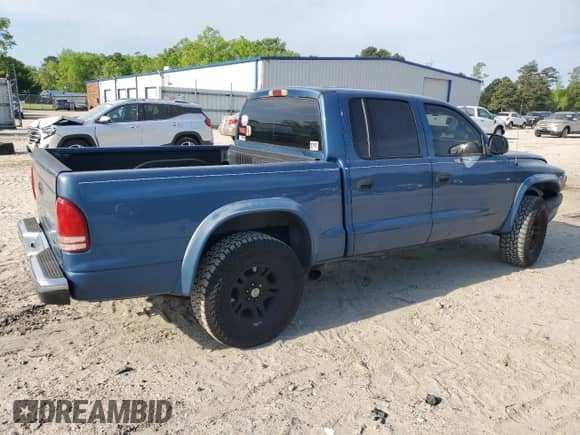 2003 Dodge Dakota Sport with VIN 1D7HL38N93S355503, listed as a Copart auction lot 53666655 with 174,638 mi miles and Salvage title. Bid and sale history available at DreamBid. Image 3.