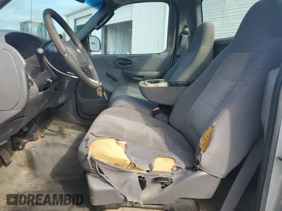 2003 Ford F-150 XL с VIN 1FTRF17W03NA77433, выставлен на аукционе Copart как лот 66132055 с пробегом 353 736 миль миль и Чистый • Clean title. История ставок и продаж доступна на DreamBid. Изображение 7.