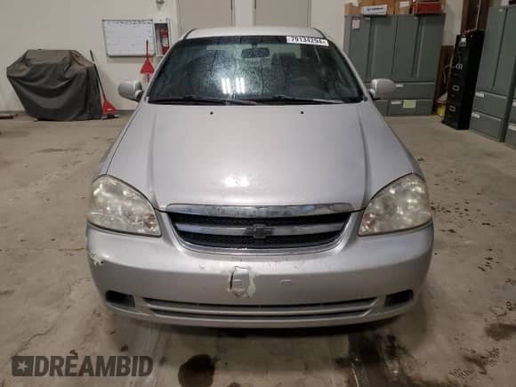 2005 Chevrolet Optra LS с VIN KL1JK59Z05K207455, выставлен на аукционе Copart как лот 79134294 с пробегом 209 198 миль миль и Чистый • Clean title. История ставок и продаж доступна на DreamBid. Изображение 5.
