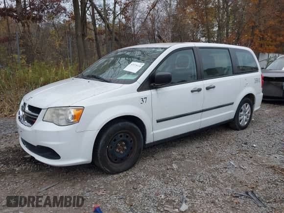 2014 Dodge Grand Caravan SE with VIN 2C4RDGBG6ER458881, listed as a IAAI auction lot 43574110 with 189,082 mi miles and . Bid and sale history available at DreamBid. Image 2.