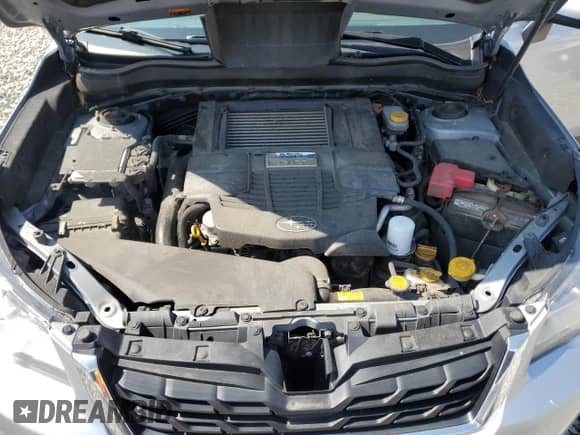 2018 Subaru Forester Premium with VIN JF2SJGECXJH411587, listed as a Copart auction lot 68100385 with 99,274 mi miles and Salvage title. Bid and sale history available at DreamBid. Image 12.