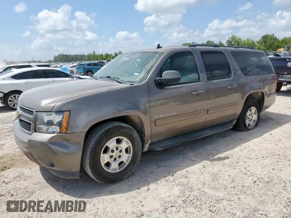 2013 Chevrolet Suburban LT with VIN 1GNSCJE01DR330091, listed as a Copart auction lot 70826395 with 187,683 mi miles and Salvage title. Bid and sale history available at DreamBid. Image 1.