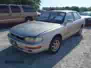 1994 Toyota Camry LE z VIN JT2SK12E4R0209720, wystawiony jako IAAI lot #42692927 z przebiegiem 155 481 mil mil oraz . Historia ofert i sprzedaży dostępna na DreamBid. Obrazek 2.