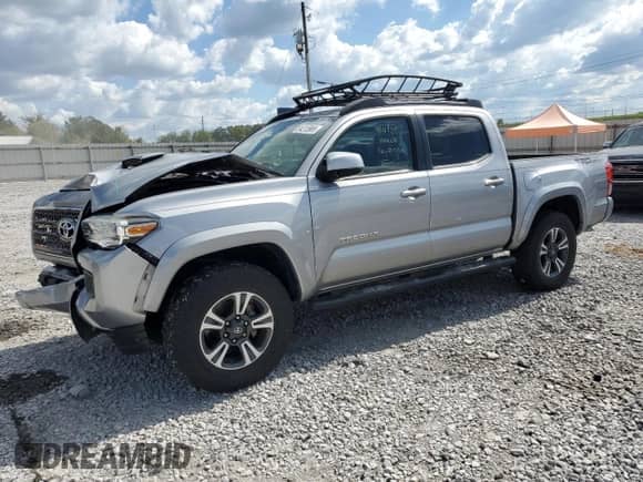 2017 Toyota Tacoma TRD Sport with VIN 5TFAZ5CN5HX030287, listed as a Copart auction lot 84213985 with 112,672 mi miles and Salvage title. Bid and sale history available at DreamBid. Image 1.