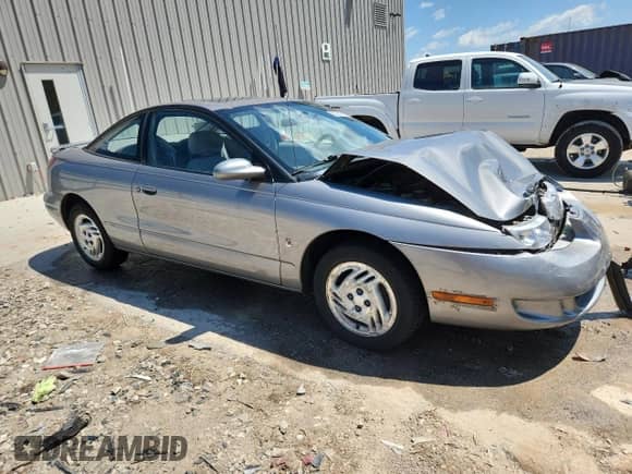 1997 Saturn 2dr Coupe with VIN 1G8ZH127XVZ108543, listed as a Copart auction lot 62389165 with 60,100 mi miles and Non repairable. Bid and sale history available at DreamBid. Image 4.