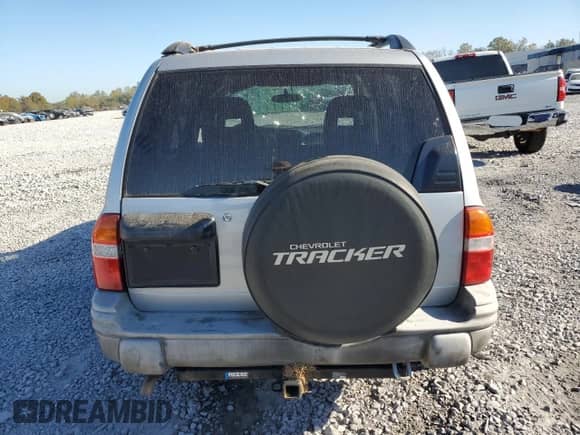 2003 Chevrolet Tracker z VIN 2CNBE13C636908563, wystawiony jako Copart lot #76871754 z przebiegiem 205 684 mil mil oraz Szkoda całkowita • Salvage title. Historia ofert i sprzedaży dostępna na DreamBid. Obrazek 6.