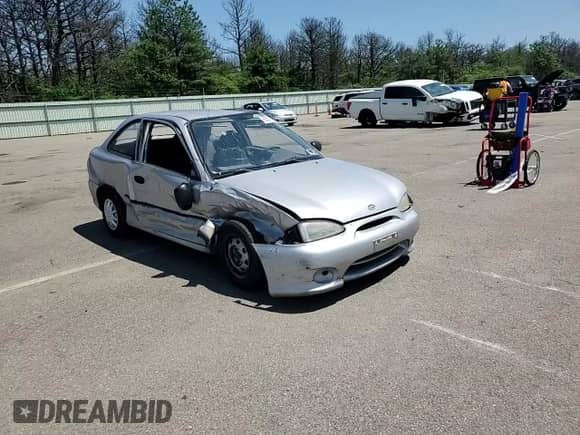 1999 Hyundai Accent L z VIN KMHVD14N9XU497814, wystawiony jako Copart lot #60374665 z przebiegiem 287 585 mil mil oraz Szkoda całkowita • Salvage title. Historia ofert i sprzedaży dostępna na DreamBid. Obrazek 14.