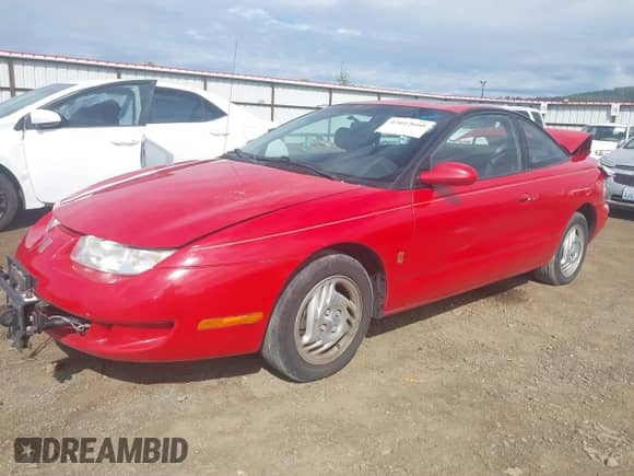 1997 Saturn 2dr Coupe with VIN 1G8ZH1272VZ206904, listed as a IAAI auction lot 43012660 with 159,456 mi miles and . Bid and sale history available at DreamBid. Image 2.