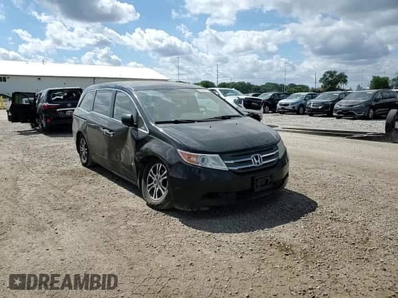 2013 Honda Odyssey EX-L z VIN 5FNRL5H64DB069561, wystawiony jako Copart lot #69430015 z przebiegiem 207 215 mil mil oraz Szkoda całkowita • Salvage title. Historia ofert i sprzedaży dostępna na DreamBid. Obrazek 14.