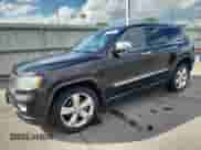 2011 Jeep Grand Cherokee Overland Summit with VIN 1J4RR6GT6BC701489, listed as a Copart auction lot 70597915 with 227,976 mi miles and Salvage title. Bid and sale history available at DreamBid. Image 1.