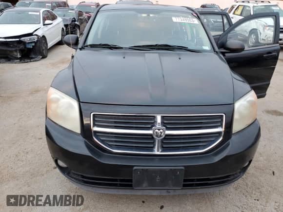 2010 Dodge Caliber Mainstreet with VIN 1B3CB3HAXAD551716, listed as a Copart auction lot 77349503 with 144,209 mi miles and Salvage title. Bid and sale history available at DreamBid. Image 5.