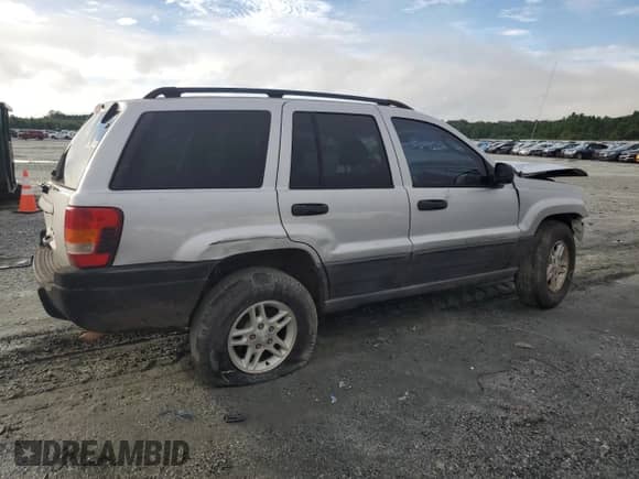 2004 Jeep Grand Cherokee Laredo with VIN 1J4GX48S04C313409, listed as a Copart auction lot 68535425 with Not provided miles and Salvage title. Bid and sale history available at DreamBid. Image 3.