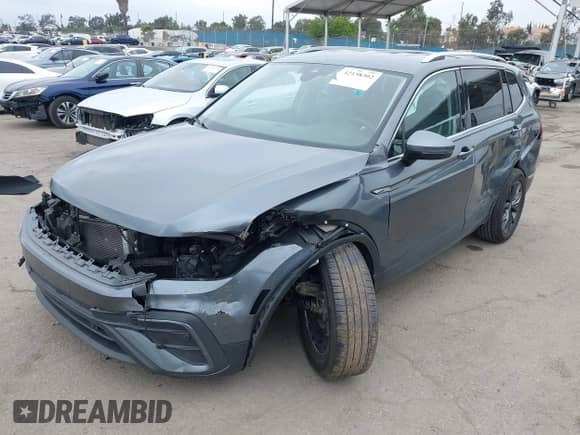 2023 Volkswagen Tiguan SE with VIN 3VV3B7AX0PM130980, listed as a IAAI auction lot 42158302 with 30,653 mi miles and . Bid and sale history available at DreamBid. Image 2.