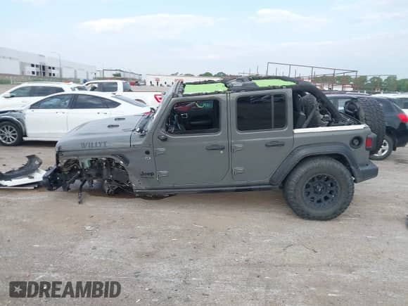 2021 Jeep Wrangler Unlimited Willys with VIN 1C4HJXDN3MW589367, listed as a IAAI auction lot 43083382 with 71,450 mi miles and . Bid and sale history available at DreamBid. Image 14.