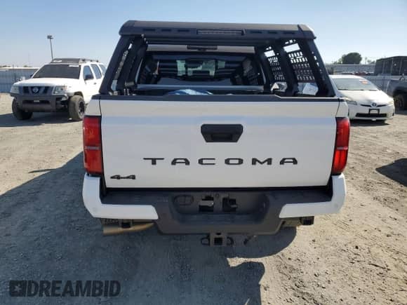 2024 Toyota Tacoma SR5 with VIN 3TMLB5JN4RM050957, listed as a Copart auction lot 71130595 with 1,873 mi miles and Salvage title. Bid and sale history available at DreamBid. Image 6.