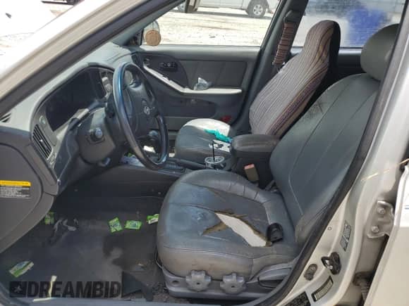 2005 Hyundai Elantra GLS with VIN KMHDN56D25U138578, listed as a Copart auction lot 61220915 with 126,702 mi miles and Salvage title. Bid and sale history available at DreamBid. Image 7.