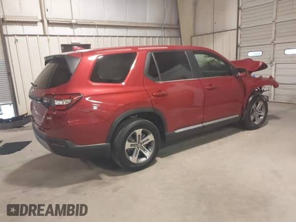 2024 Honda Pilot EX-L with VIN 5FNYG2H51RB011873, listed as a IAAI auction lot 40864411 with 6,593 mi miles and . Bid and sale history available at DreamBid. Image 4.