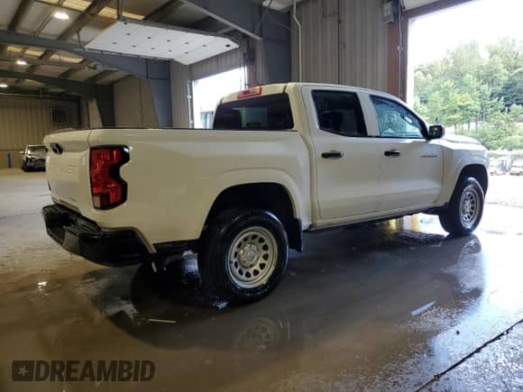 2023 Chevrolet Colorado 2WD Work Truck z VIN 1GCGSBEC9P1174158, wystawiony jako Copart lot #71965015 z przebiegiem 26 689 mil mil oraz Czysty tytuł • Clean title. Historia ofert i sprzedaży dostępna na DreamBid. Obrazek 3.
