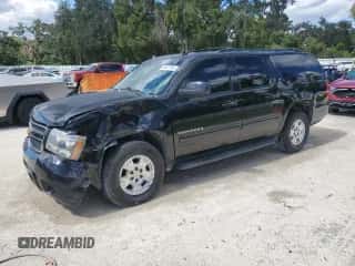 2014 Chevrolet Suburban LT with VIN 1GNSCJE01ER122858, listed as a Copart auction lot 86877895 with 181,574 mi miles and Salvage title. Bid and sale history available at DreamBid. Image 1.