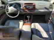 2004 Toyota Camry LE with VIN JTDBF30KX40153887, listed as a Copart auction lot 82175725 with Not provided miles and Salvage title. Bid and sale history available at DreamBid. Image 8.