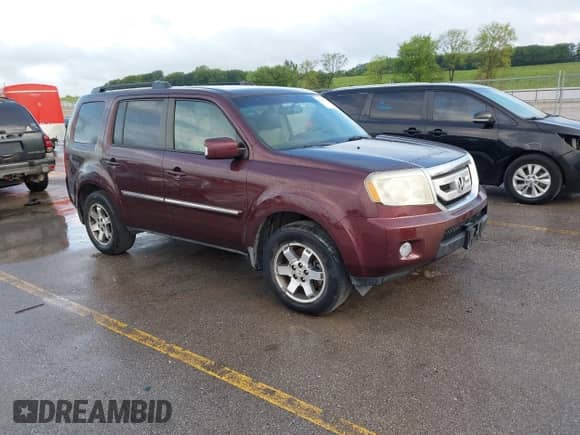 2009 Honda Pilot Touring with VIN 5FNYF38819B022195, listed as a IAAI auction lot 42850497 with 192,072 mi miles and . Bid and sale history available at DreamBid. Image 1.