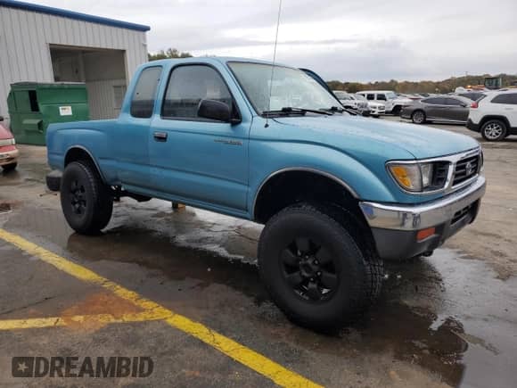 1997 Toyota Tacoma z VIN 4TAWM72NXVZ296658, wystawiony jako Copart lot #78831984 z przebiegiem 228 827 mil mil oraz Szkoda całkowita • Salvage title. Historia ofert i sprzedaży dostępna na DreamBid. Obrazek 4.