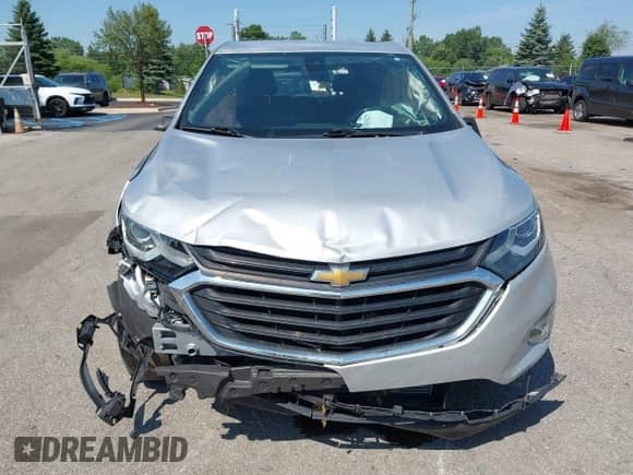 2019 Chevrolet Equinox LT z VIN 2GNAXJEV7K6230579, wystawiony jako IAAI lot #42834271 z przebiegiem 96 912 mil mil oraz . Historia ofert i sprzedaży dostępna na DreamBid. Obrazek 12.