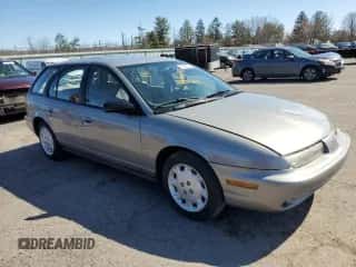 1997 Saturn SW z VIN 1G8ZK8274VZ194085, wystawiony jako Copart lot #50230135 z przebiegiem 211 051 mil mil oraz Szkoda całkowita • Salvage title. Historia ofert i sprzedaży dostępna na DreamBid. Obrazek 4.