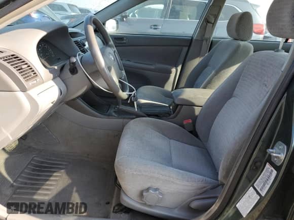 2003 Toyota Camry LE z VIN JTDBE32K030139057, wystawiony jako Copart lot #71503125 z przebiegiem 74 753 mil mil oraz Szkoda całkowita • Salvage title. Historia ofert i sprzedaży dostępna na DreamBid. Obrazek 7.