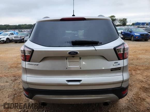 2018 Ford Escape SE with VIN 1FMCU9GD2JUB39549, listed as a Copart auction lot 84175385 with 127,811 mi miles and Salvage title. Bid and sale history available at DreamBid. Image 6.
