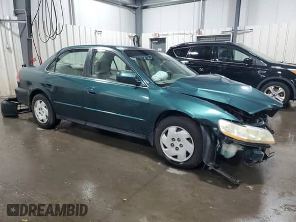2002 Honda Accord LX with VIN 1HGCG16442A043585, listed as a Copart auction lot 74481474 with 223,446 mi miles and Salvage title. Bid and sale history available at DreamBid. Image 4.