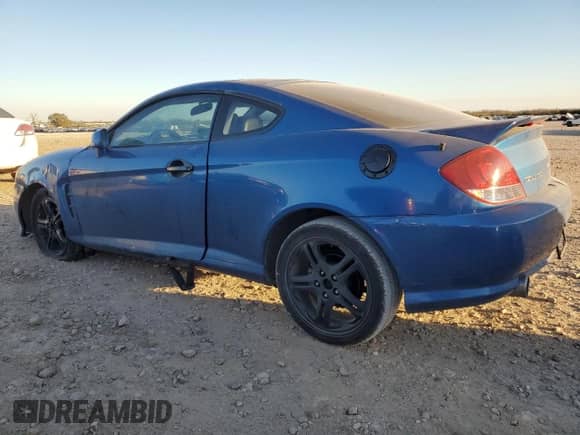 2005 Hyundai Tiburon GT with VIN KMHHN65F35U186438, listed as a Copart auction lot 41879955 with 152,574 mi miles and Salvage title. Bid and sale history available at DreamBid. Image 2.