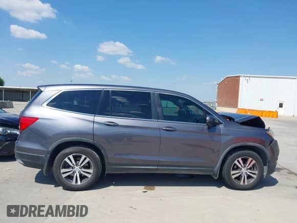 2017 Honda Pilot EX-L with VIN 5FNYF5H58HB027491, listed as a IAAI auction lot 43356758 with 124,805 mi miles and . Bid and sale history available at DreamBid. Image 14.