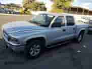 2004 Dodge Dakota Sport z VIN 1D7HL38N44S573883, wystawiony jako Copart lot #74955984 z przebiegiem 165 510 mil mil oraz Szkoda całkowita • Salvage title. Historia ofert i sprzedaży dostępna na DreamBid. Obrazek 1.