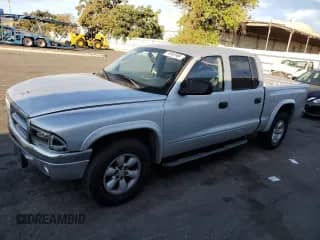 2004 Dodge Dakota Sport z VIN 1D7HL38N44S573883, wystawiony jako Copart lot #74955984 z przebiegiem 165 510 mil mil oraz Szkoda całkowita • Salvage title. Historia ofert i sprzedaży dostępna na DreamBid. Obrazek 1.