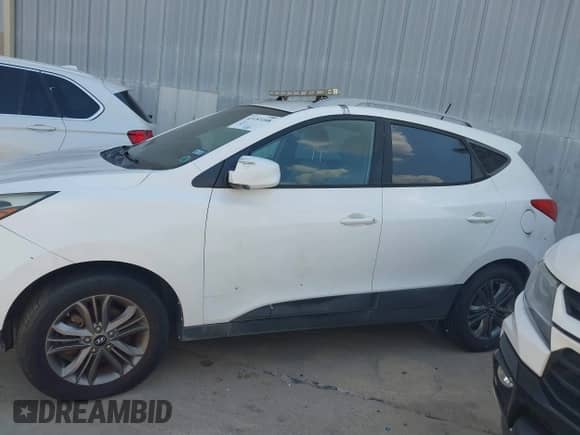 2015 Hyundai Tucson SE with VIN KM8JU3AG4FU115462, listed as a IAAI auction lot 43153108 with 97,807 mi miles and . Bid and sale history available at DreamBid. Image 14.