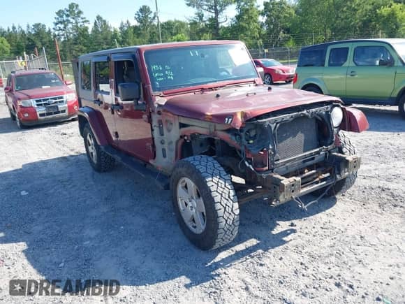 2007 Jeep Wrangler Unlimited Sahara z VIN 1J8GA59187L211825, wystawiony jako IAAI lot #42313099 z przebiegiem 107 554 mil mil oraz . Historia ofert i sprzedaży dostępna na DreamBid. Obrazek 1.