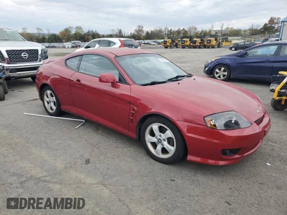 2006 Hyundai Tiburon GS with VIN KMHHM65D86U203902, listed as a Copart auction lot 85872545 with 102,778 mi miles and Salvage title. Bid and sale history available at DreamBid. Image 4.