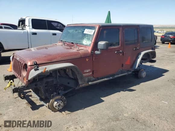 2007 Jeep Wrangler Unlimited Sahara z VIN 1J4GA59157L122909, wystawiony jako Copart lot #67484885 z przebiegiem Nie podano mil oraz Szkoda całkowita • Salvage title. Historia ofert i sprzedaży dostępna na DreamBid. Obrazek 1.