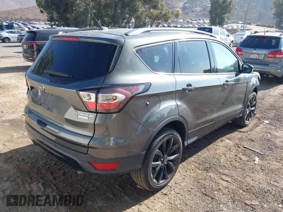 2017 Ford Escape Titanium with VIN 1FMCU0J90HUB61155, listed as a IAAI auction lot 43352339 with 100,918 mi miles and . Bid and sale history available at DreamBid. Image 4.