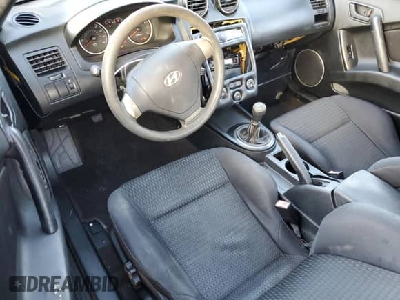 2008 Hyundai Tiburon GS с VIN KMHHM66D28U269752, выставлен на аукционе Copart как лот 79088484 с пробегом 105 861 миль миль и На запчасти • Non repairable. История ставок и продаж доступна на DreamBid. Изображение 8.